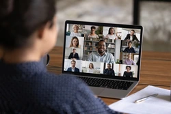 stock photo over shoulder view of female worker have webcam digital virtual conference with diverse multiethnic 250nw 1938542422